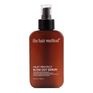Brown bottle of 'the hair method' heat protect blowout serum on a white background