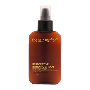 Bottle of 'the hair method' Restorative Bonding Cream on a white background