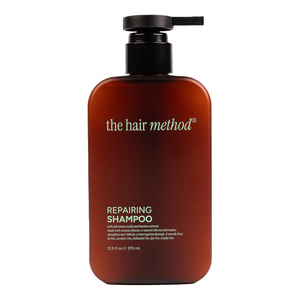 Brown shampoo bottle with black pump labeled 'the hair method' on a white background