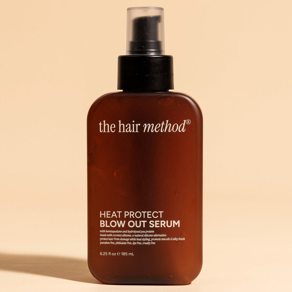 brown cosmetic bottle with black pump on a white background. 