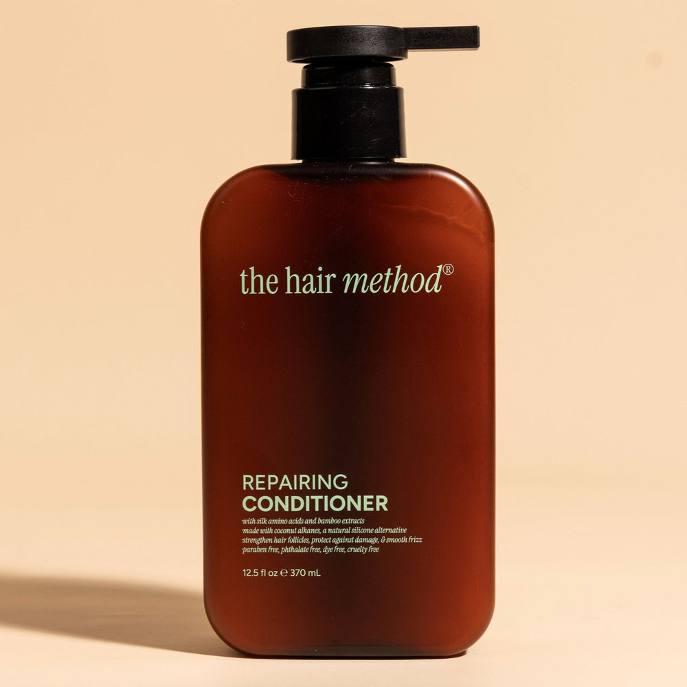 brown cosmetic bottle with black pump on a white background. 