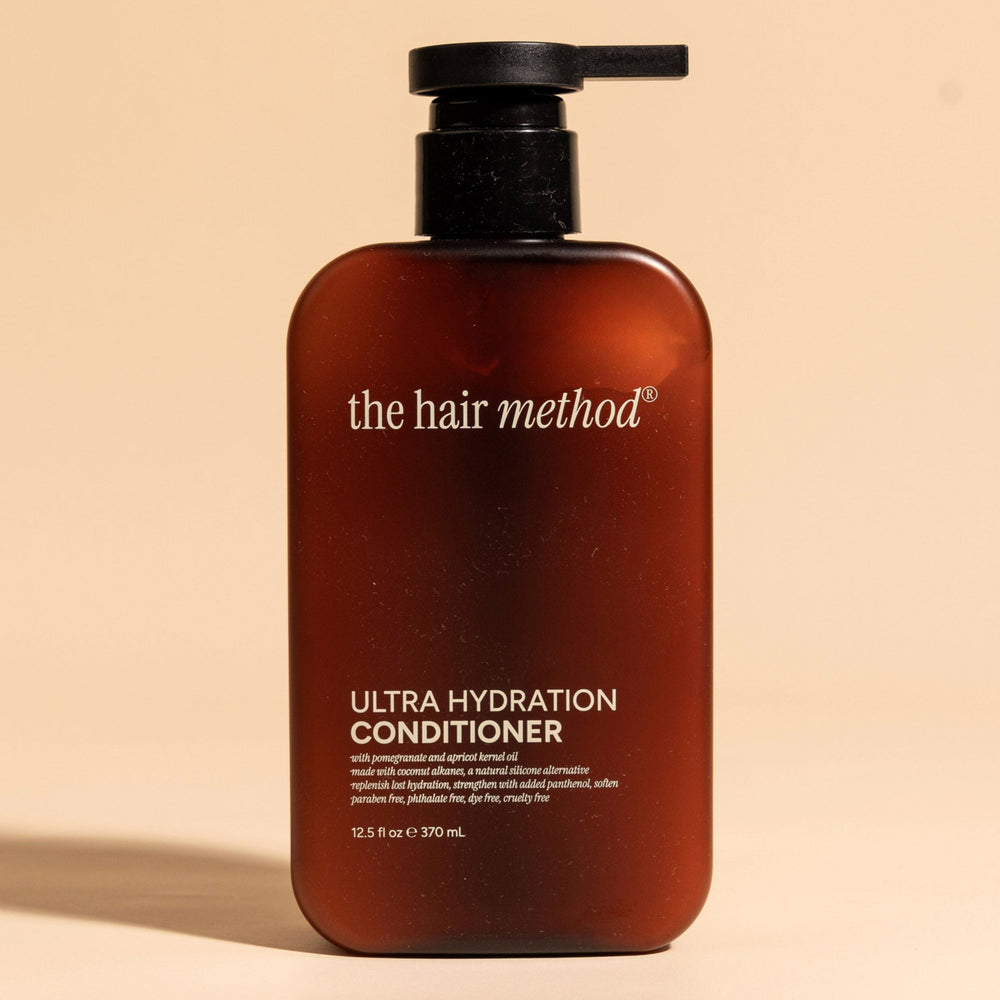 brown cosmetic bottle with black pump on a white background. 