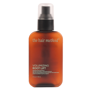 Amber bottle of 'the hair method' volumizing root lift on a white background