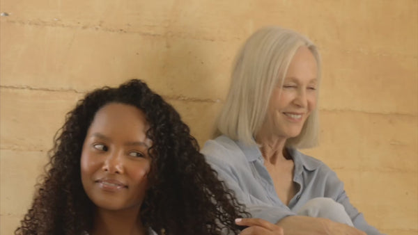 a slow motion video of models looking and chatting with one another. there is no audio to the video. There is no audio.
