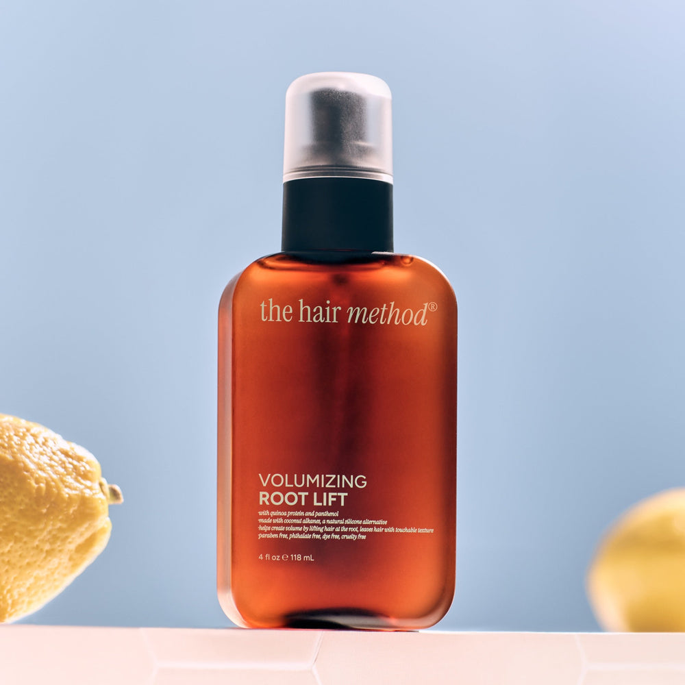 Amber bottle of 'the hair method' volumizing root lift on a white background